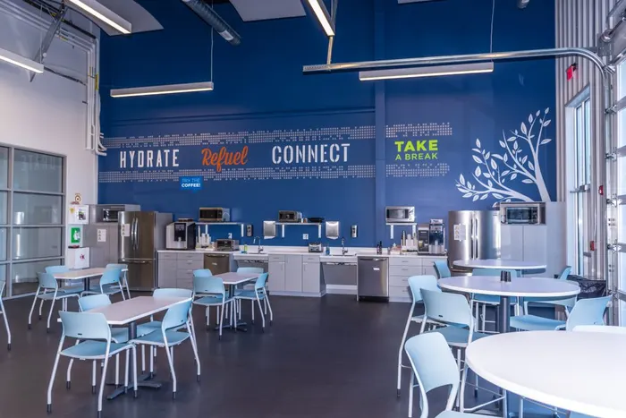 Corporate break room with blue feature wall